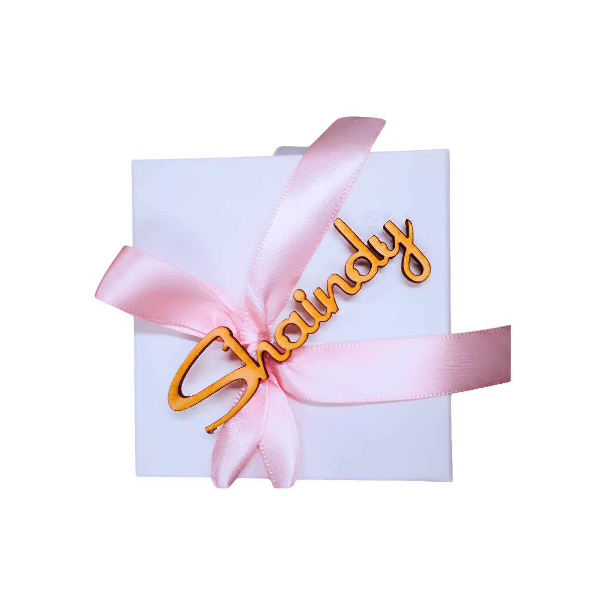 White personalized gift box wrapped with a pink satin ribbon and gold “Chanu...ly” name decoration.