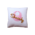 Personalized white decorative pillow featuring a pink circular design and gold script name “Shaundy.”