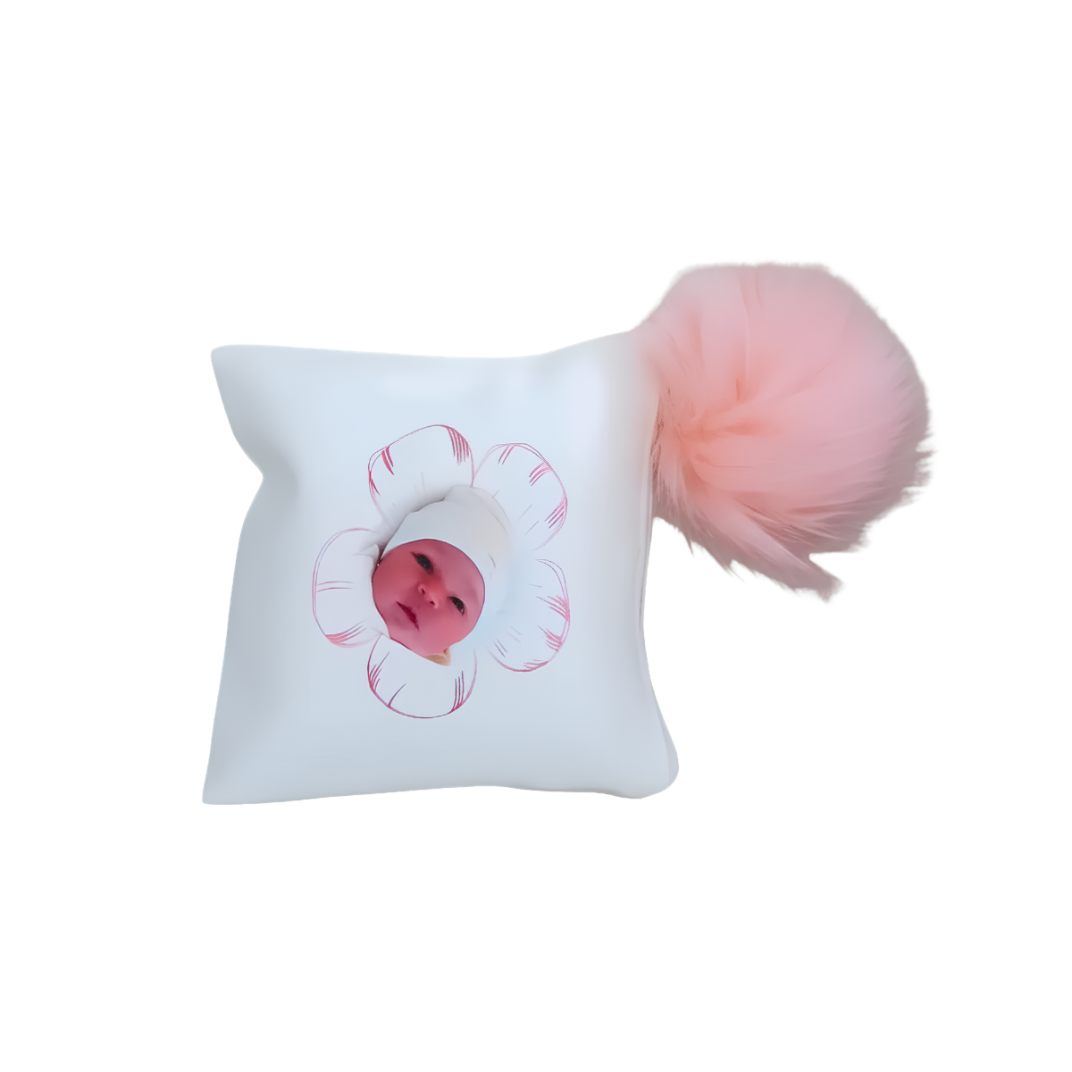 Personalized white decorative baby pillow featuring a baby photo inside a pink flower design and a fluffy pink pom-pom accent.