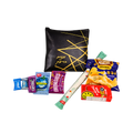 Black personalized gift pouch with gold line detailing, arranged with assorted colorful candy, packaged snacks, and a long green-and-white candy stick.