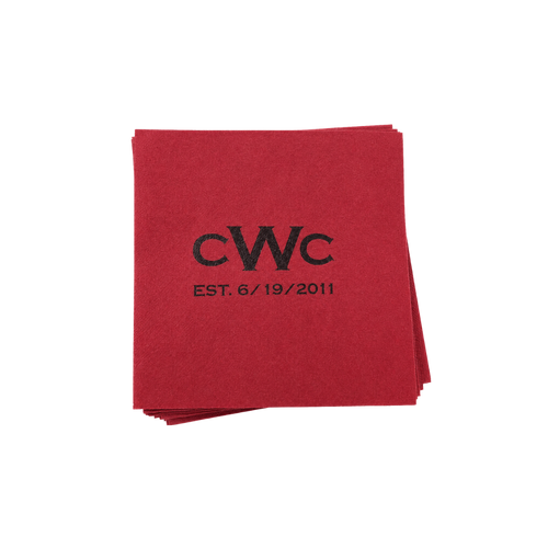 Red personalized fabric napkins featuring a black CWC logo and established date design.