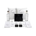 White and black gift set featuring personalized pouches, small gift bags, labeled boxes, and decorative packaging arranged together.
