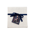 Personalized white linen gift pouch with a navy blue ribbon, featuring a decorative photo tag attached to the front.