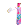 Colorful personalized gift bottle with a bright pink cap, multicolor decorative design, and attached gift tag.