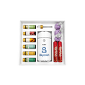 Custom Skymish gift box with colorful beverage cans, chocolate bars, branded accessories, and red wrapped treats arranged inside a white presentation box.