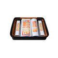 Black gift basket with an orange-lined interior, containing personalized white and silver packaged items with bold orange lettering and geometric logos.