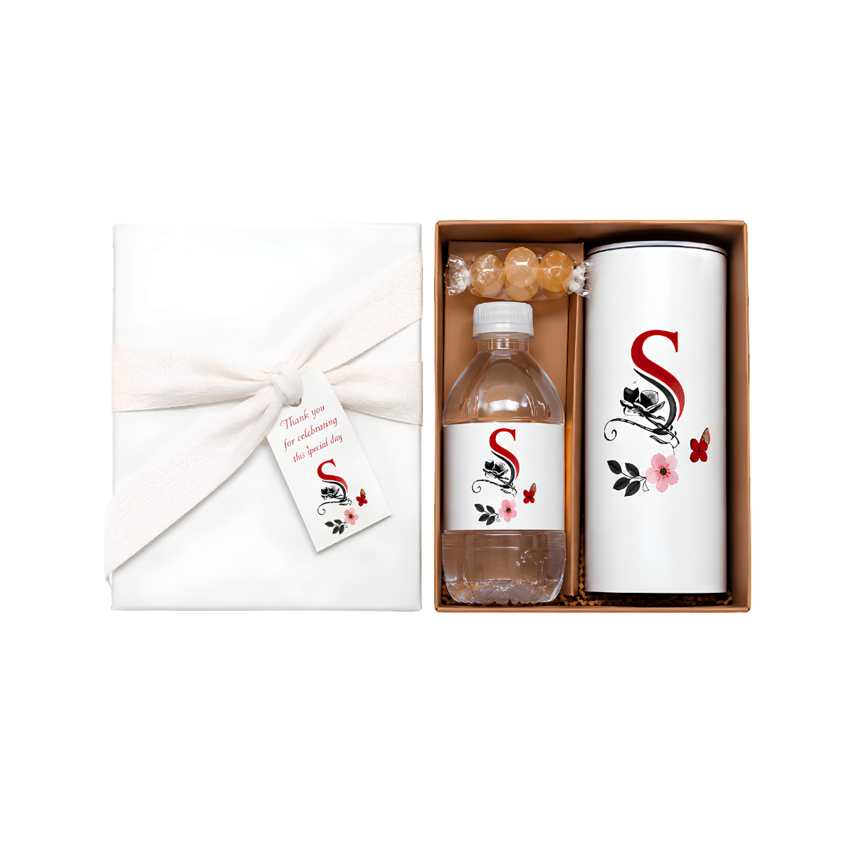 Elegant personalized gift set featuring a white wrapped box with a floral gift tag, a matching bottle of treats, and a tall white bottle with a red monogram and floral design.